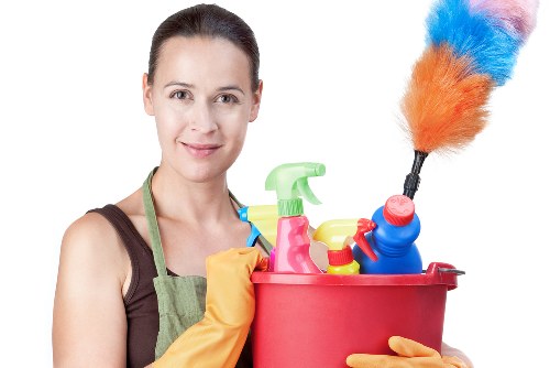 A professional cleaner removing construction dust from a Kingston home after renovation
