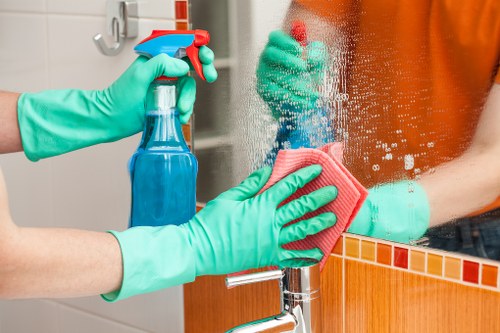 Technician applying safe carpet cleaning procedures during service