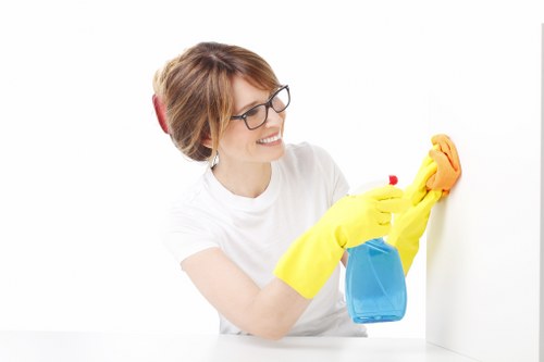 Local cleaner preparing a Kingston apartment for new guests