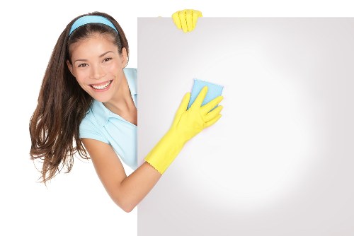 Professional cleaners preparing a Kingston flat for handover